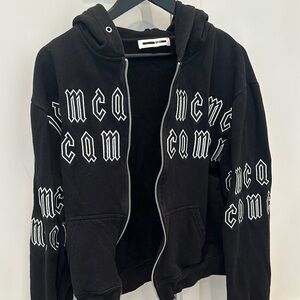 Black MCQ Zip-Up Hoodie with White Lettering
UNISEX